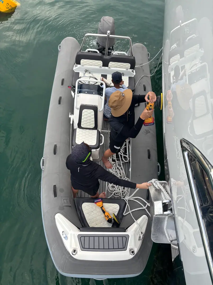 PA team working from a tender alongside a yacht