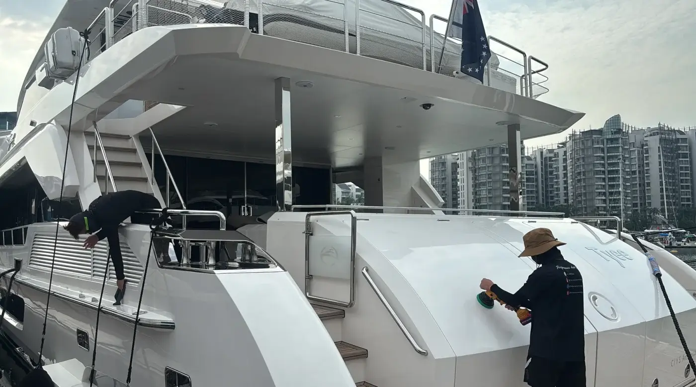 PA detailer polishing a yacht stern at the berth
